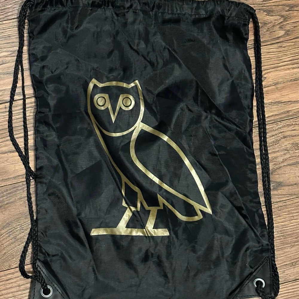 Black Drawstring Bag with Gold Owl Logo